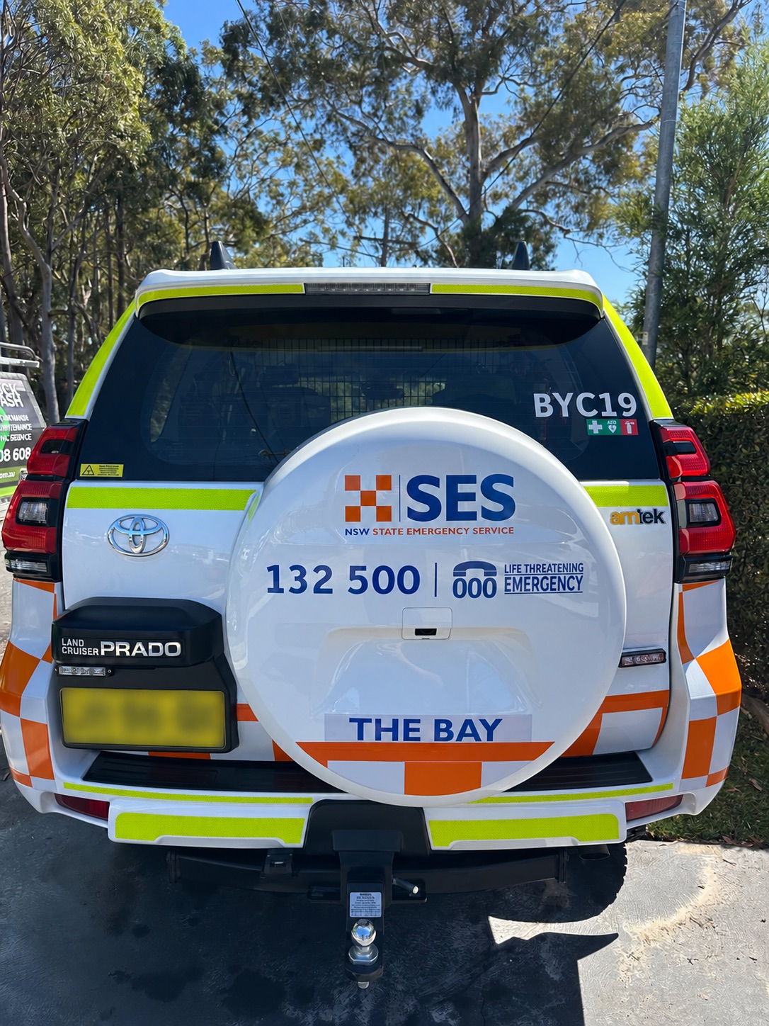 Rear of emergency-service vehicle with registration plate obscured